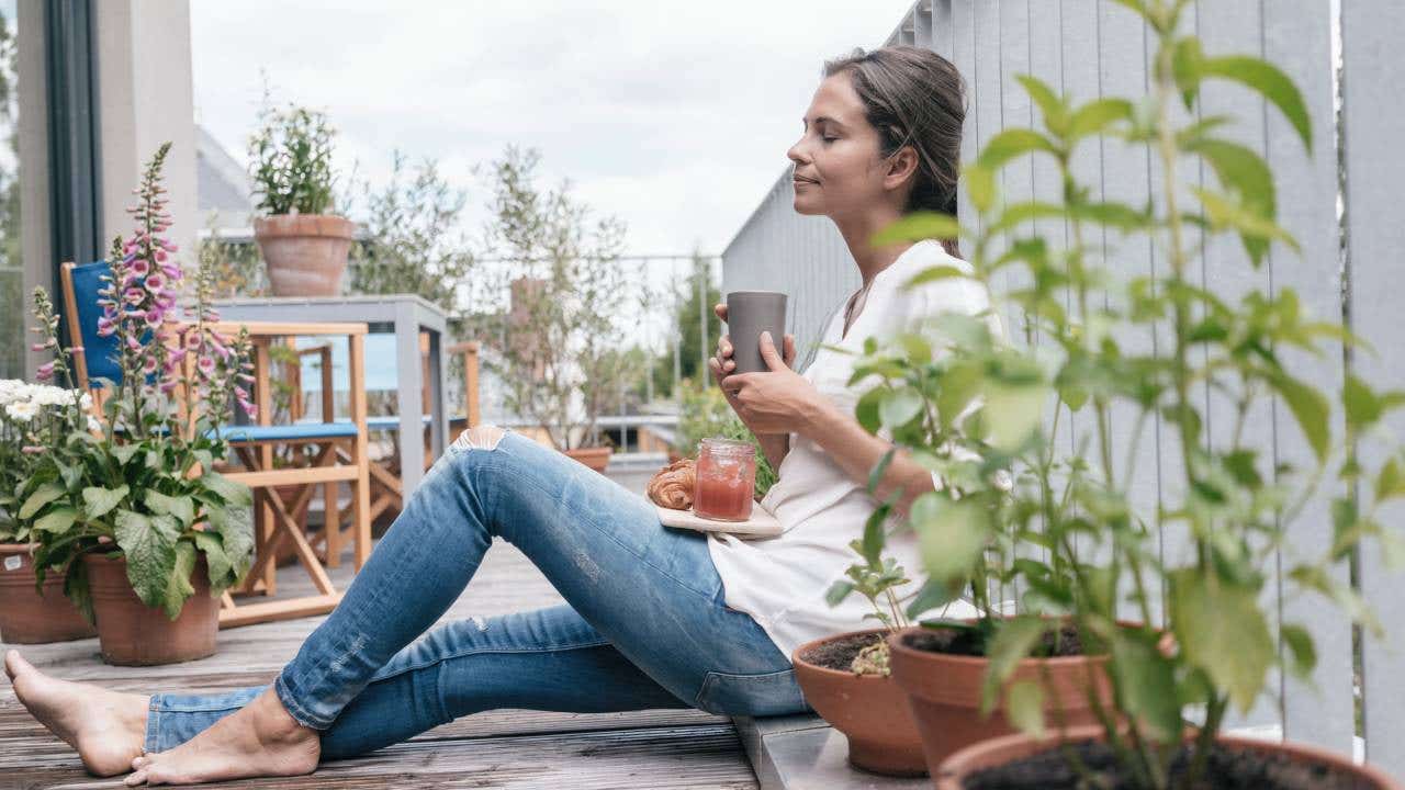 Woman relaxing on balcony