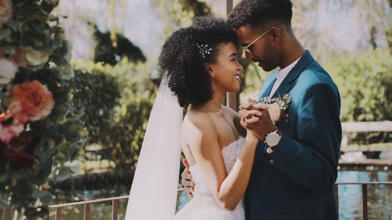 Cropped shot of a happy newlywed couple dancing together after their outdoor wedding