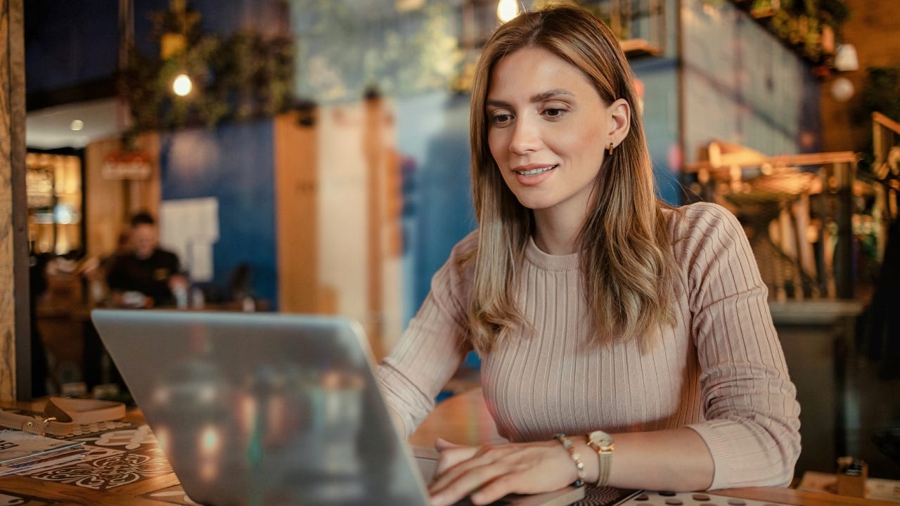 Happy woman using a computer