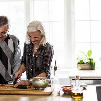 Senior couple preparing dinner