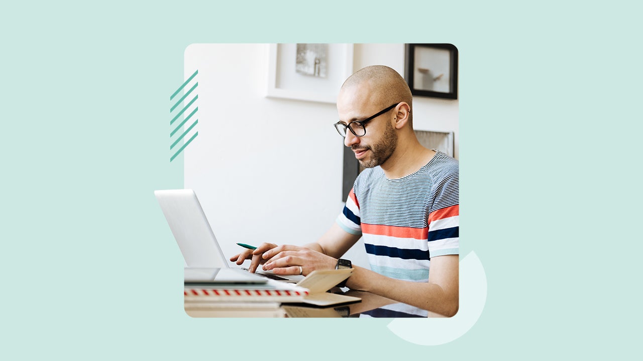 A man sitting at a laptop