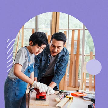A boy and a man working together on a construction project