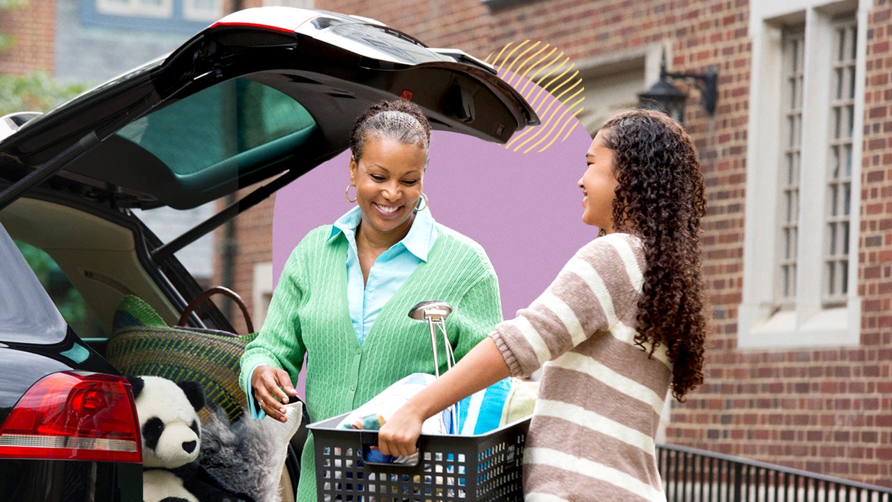 Young black woman handing plastic bin to older black woman to put basket into trunk of vehicle.