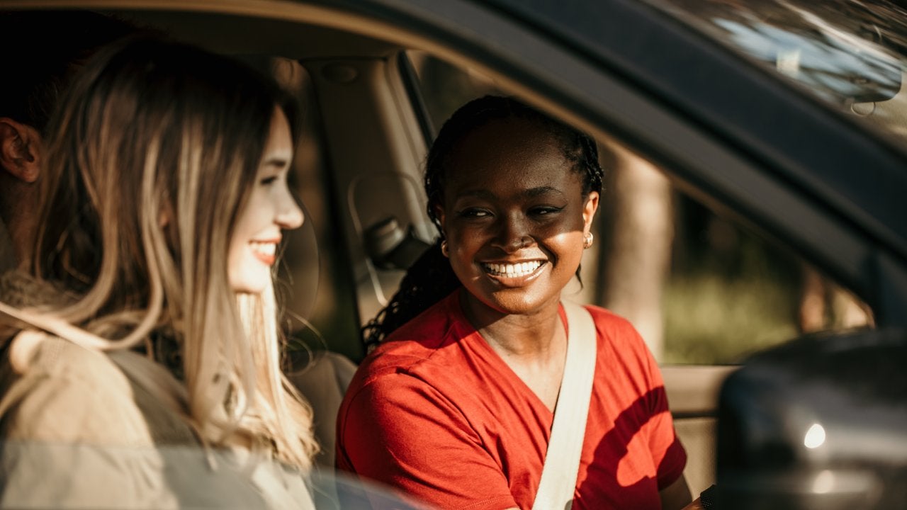 female friends driving in car