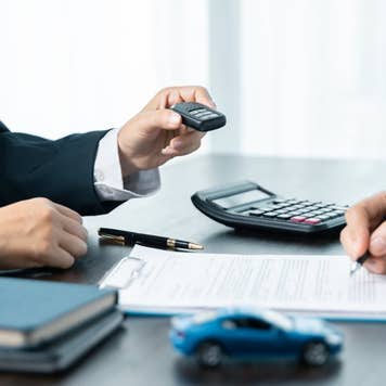 car saler or sales manager offers to sell a car