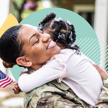 A soldier embracing her young child
