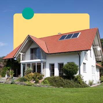 Image of a white house surrounded by greenery