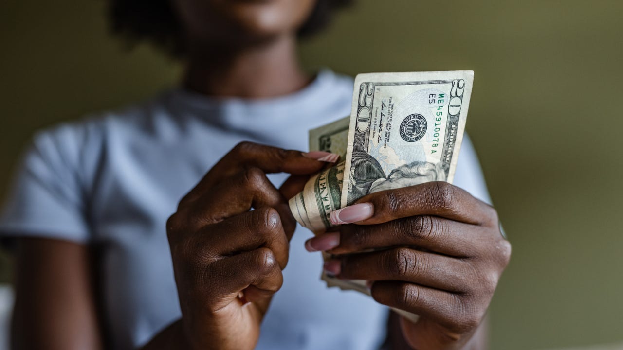 Close up of a woman counting money