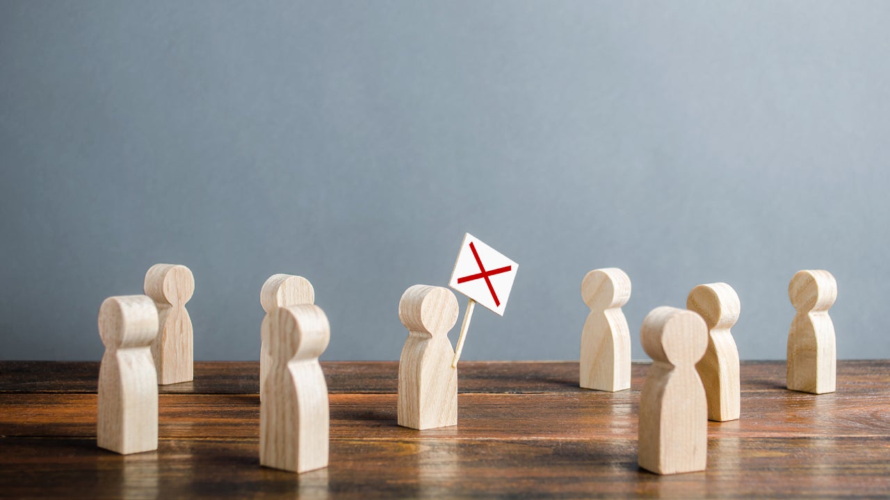 Wooden figurines modeling a workers strike