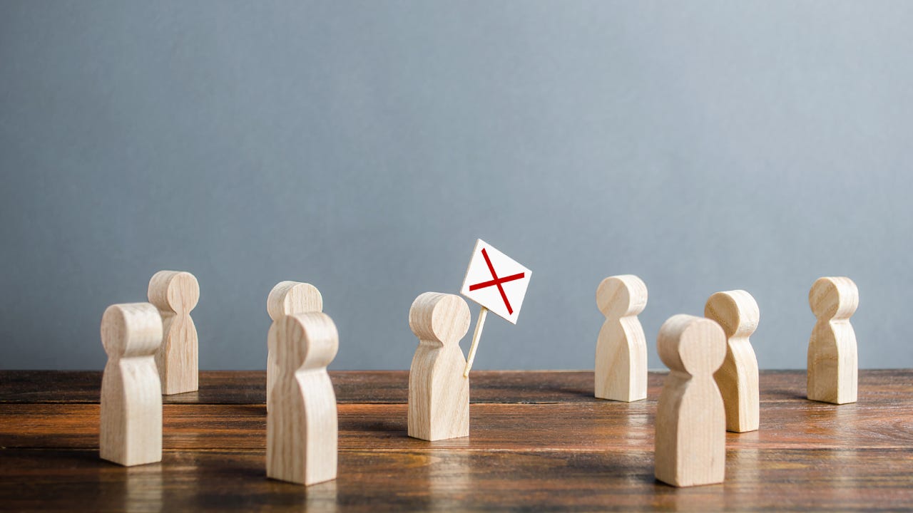 Wooden figurines modeling a workers strike