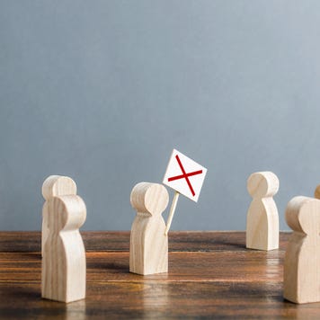 Wooden figurines modeling a workers strike