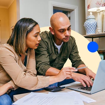 Two people working together on a laptop