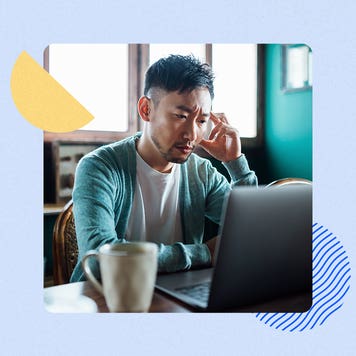 Man at laptop looking stressed