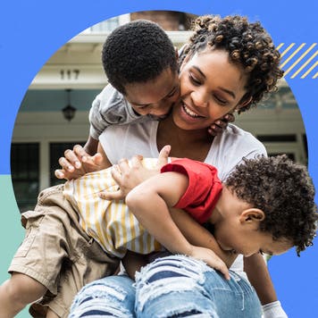 Mother holding two children