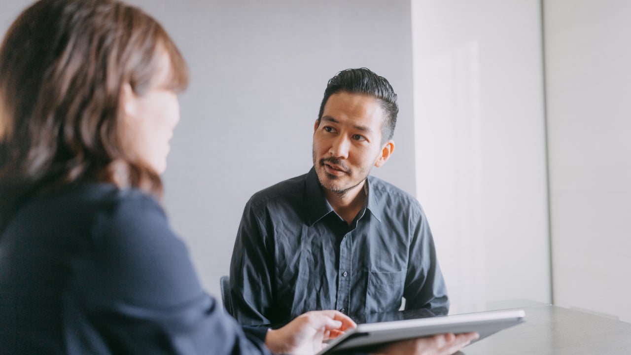 Man meeting banker for financial advice in a meeting room