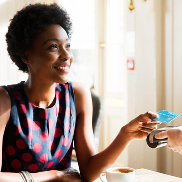 Woman using contactless payment - stock photo