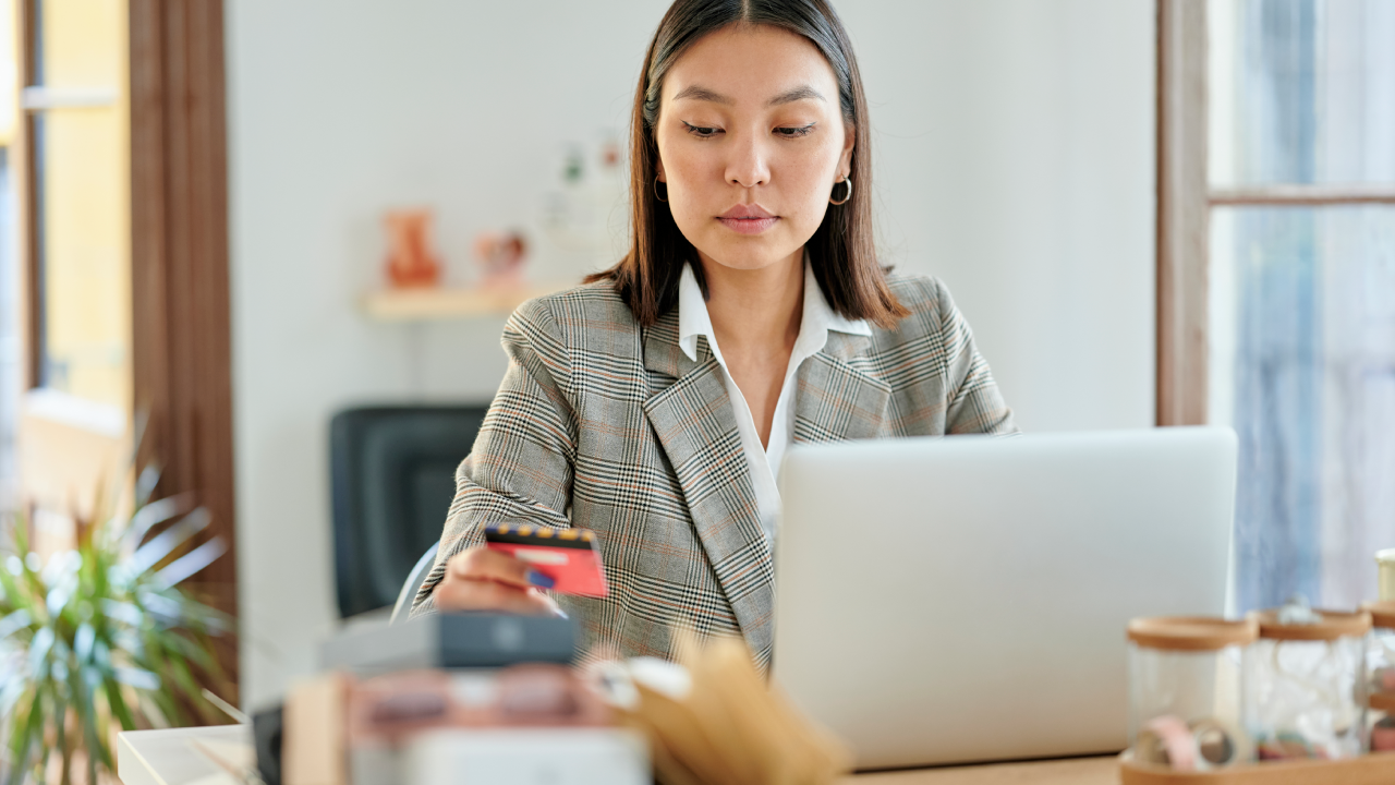 Woman using credit card for online payments