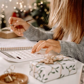 Woman working on finances during the holiday season