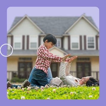 A woman plays with a child on the lawn in front of a white, two-story house. The image has a purple border.