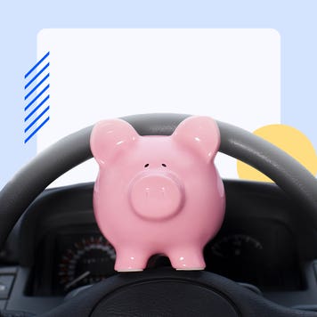 piggy bank on a steering wheel