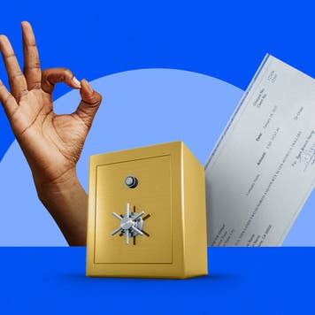 A hand making an "OK" sign, a bank vault, and a check