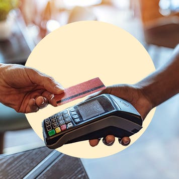 Illustration of a customer holding a credit card above a vendor machine.