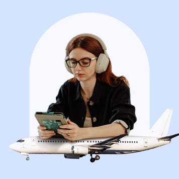 Young woman with headphones looks at smartphone with airplane beneath her.