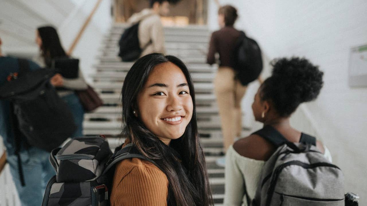 Portrait of smiling female student at university