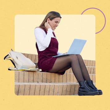 Young woman sitting outside on a laptop