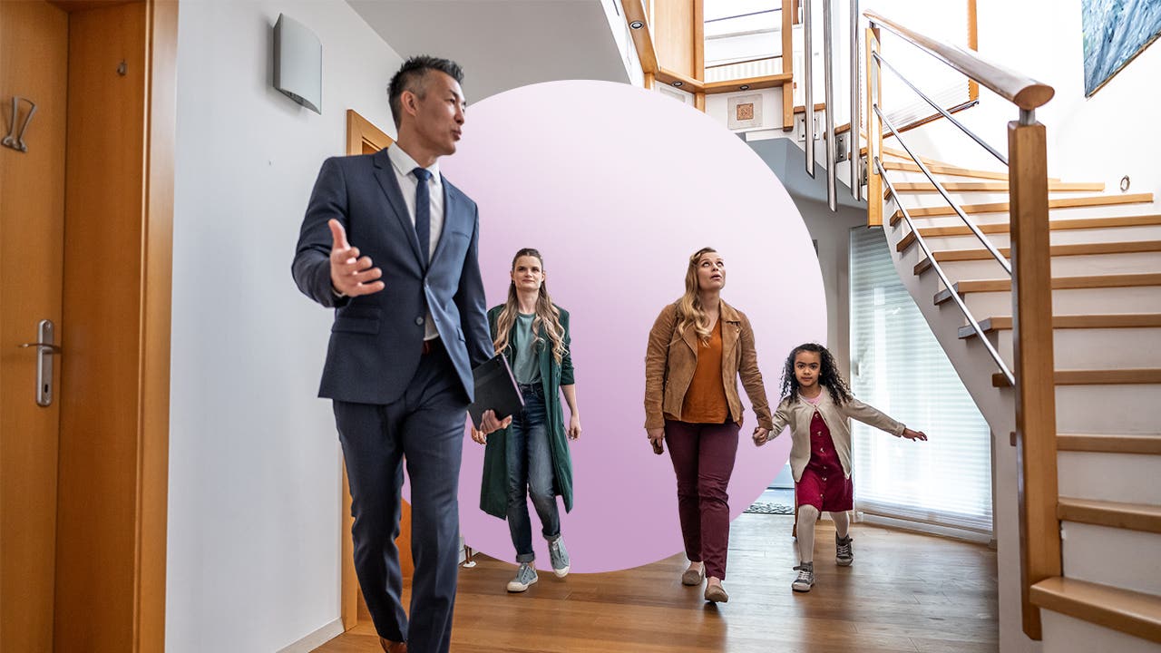 Realtor showing family house with modern stairs