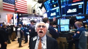 Traders work during the opening bell at the New York Stock Exchange (NYSE) on February 28, 2020 at Wall Street in New York City.