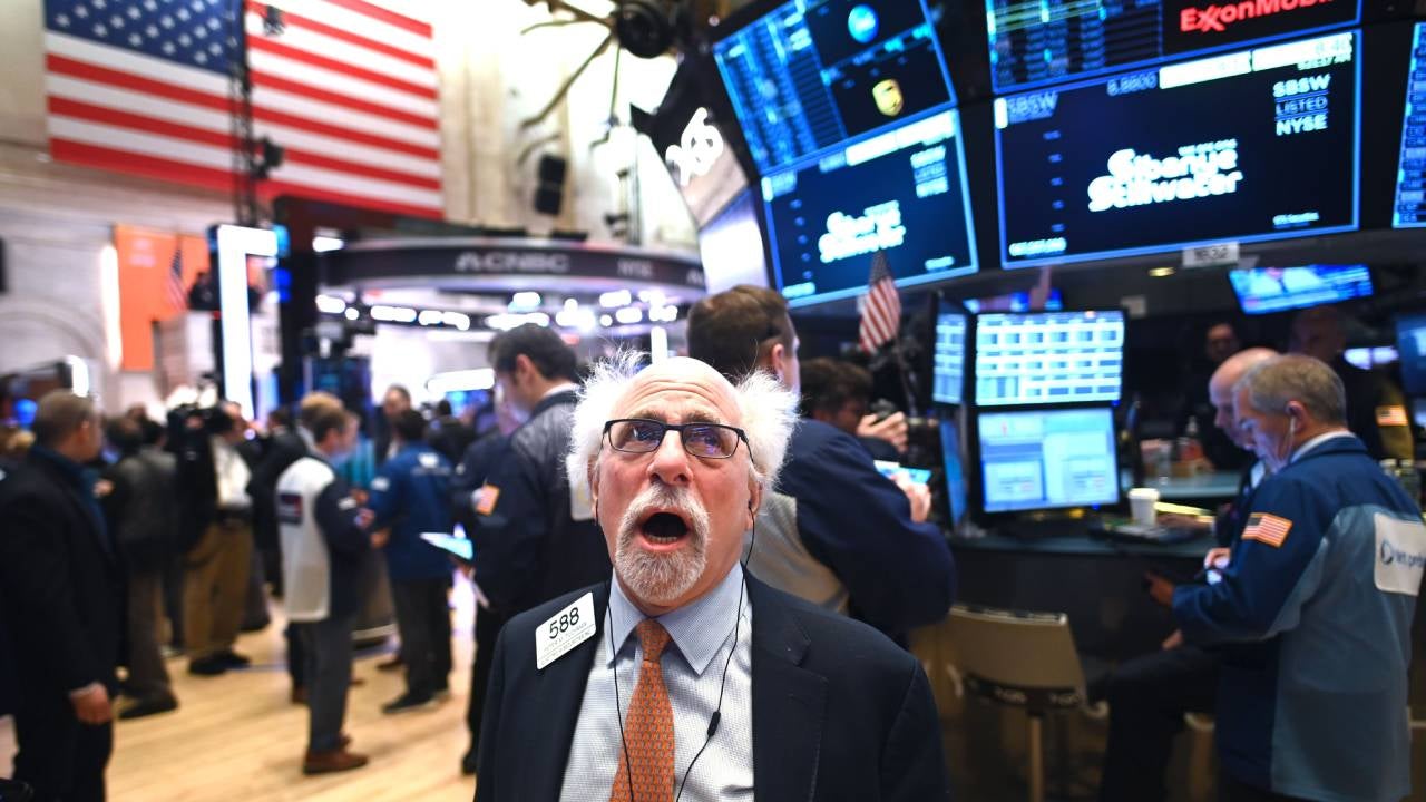 Traders work during the opening bell at the New York Stock Exchange (NYSE) on February 28, 2020 at Wall Street in New York City.