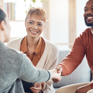 Black couple, financial advisor and handshake on home sofa