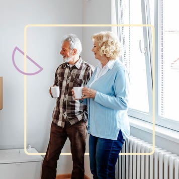 Two people drinking a hot beverage