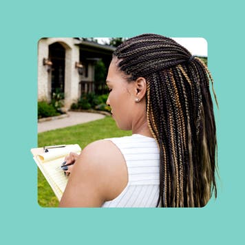 home appraiser filling out info on clipboard