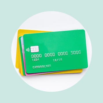 A pile of credit cards on a graphic background