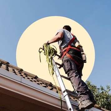 Man working on the roof of a house
