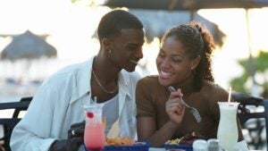 Smiling couple at outdoor restaurant