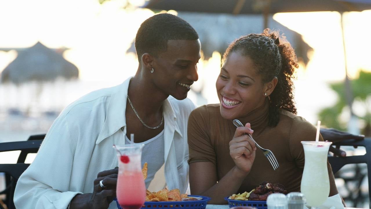 Smiling couple at outdoor restaurant