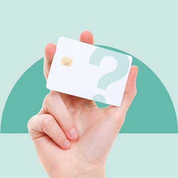 design image of a hand holding up a white credit card with a question mark over it