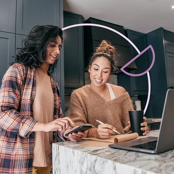 two women looking to buy a house online