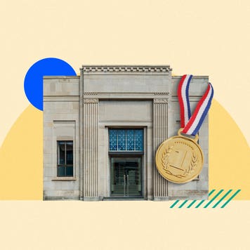 A bank building with a large gold medal hanging from it