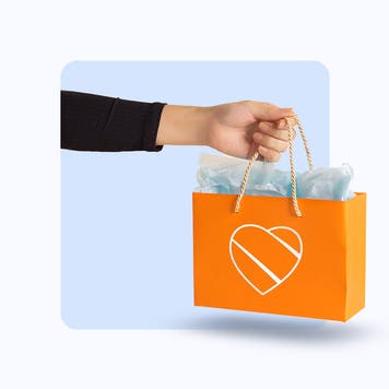 Illustration of hand holding an orange bag with the Southwest Airlines logo on it.