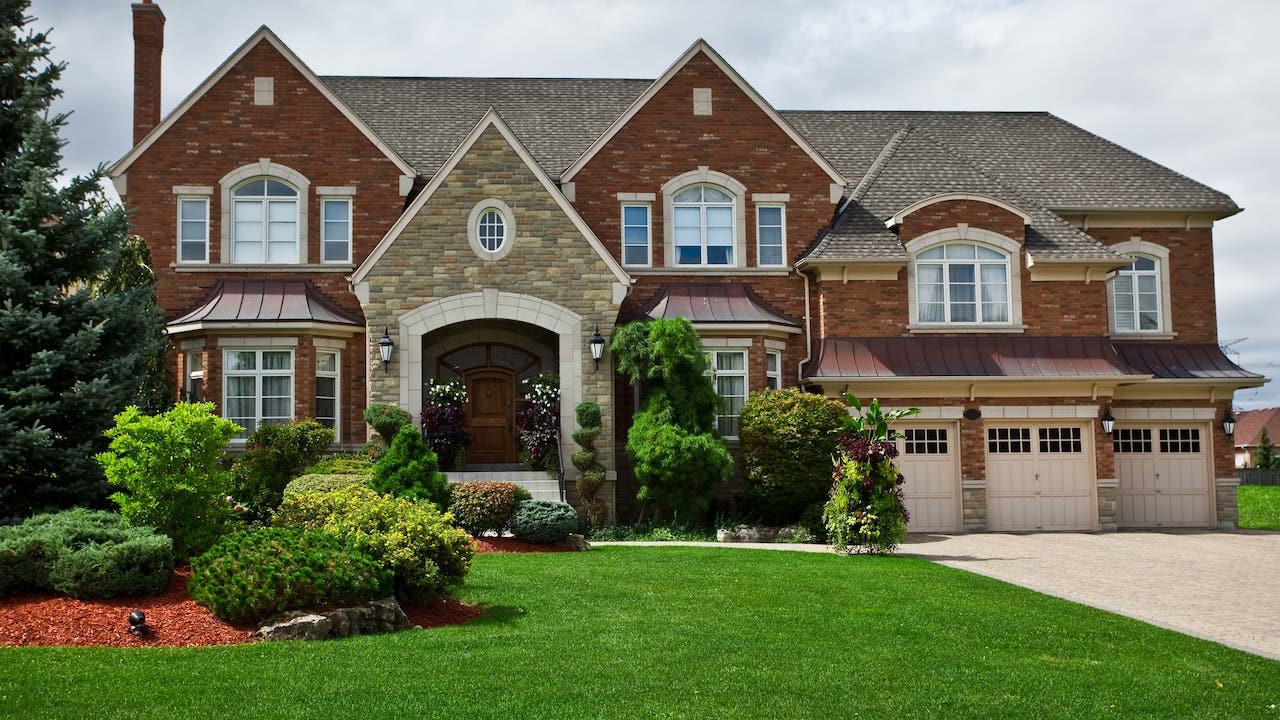 exterior of large nicely landscaped suburban house