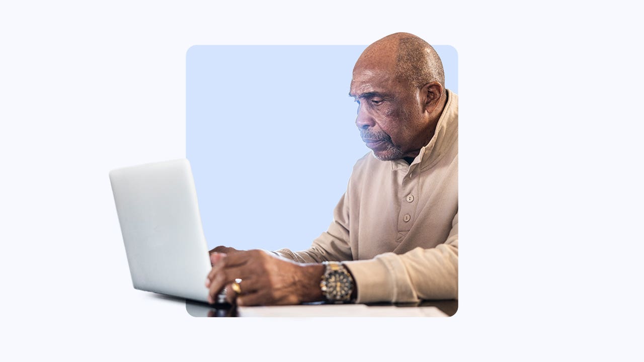 Older gentleman using a laptop