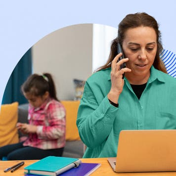 Woman working from home with a child in the background