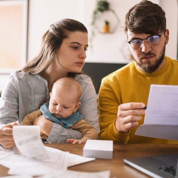Young family managing budget and paying bills and taxes