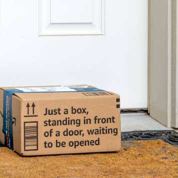 Amazon cardboard box on doorstep.