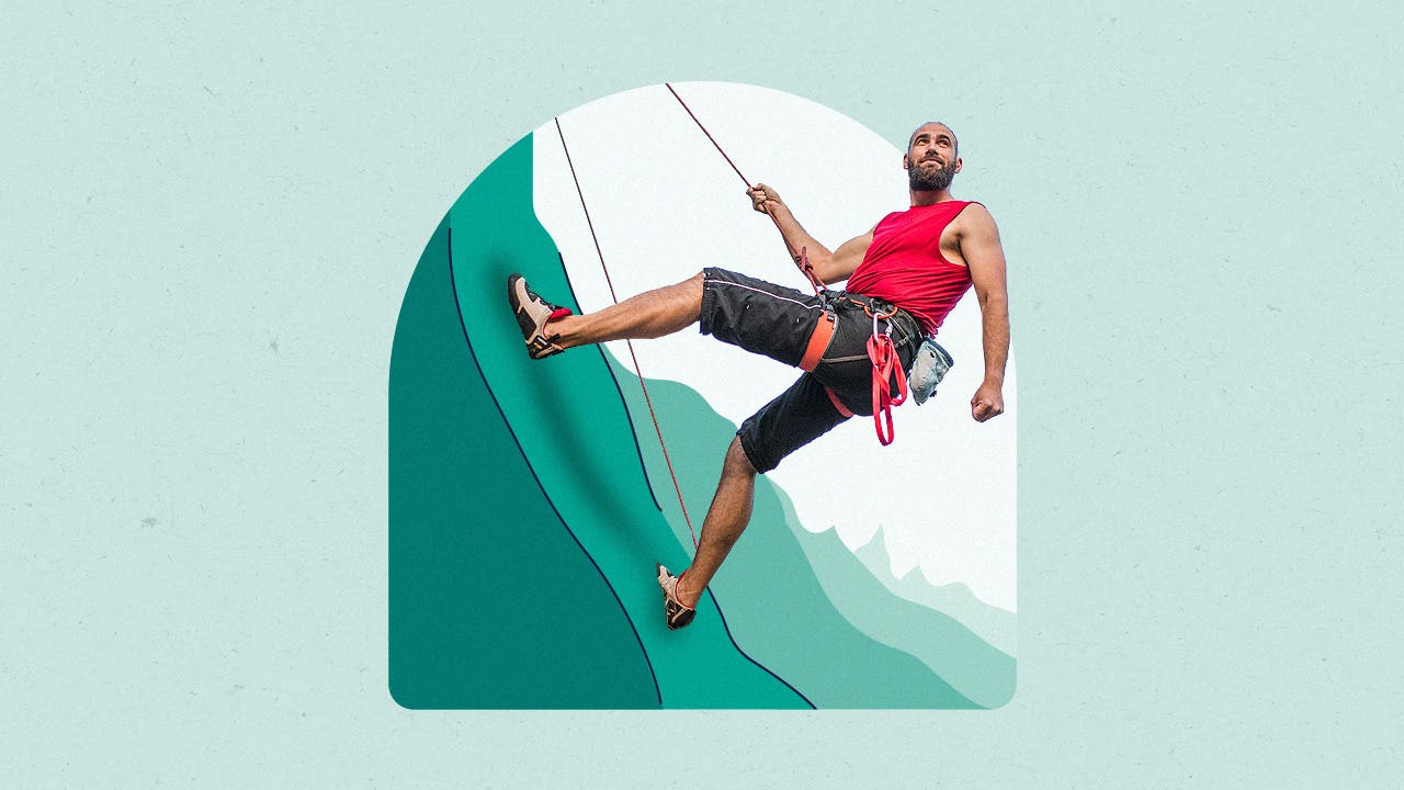 Man climbing up an illustrated mountain