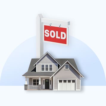 House with a "sold" sign